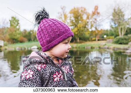 Stock Image - Toddler by lake, Reykjavik, Iceland. Fotosearch