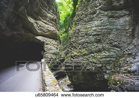Picture - Tunnel in rock hill, Garda, Italy. Fotosearch