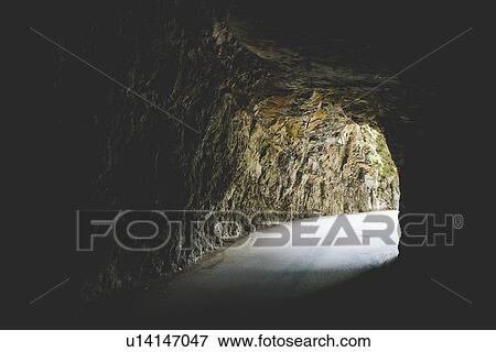 Stock Photo - Tunnel in rock hill, Garda, Italy. Fotosearch