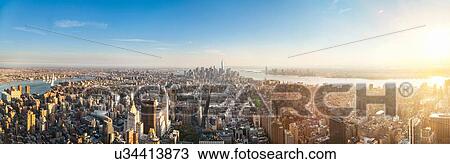 Stock Image - Vast panoramic cityscape with skyscrapers and distant rivers, New York, USA. Fotosearch