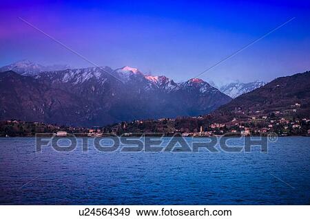 View of mountains and Lake Como at dusk, Italy View Large Photo Image Stock Photo - View of mountains and Lake Como at dusk, Italy. Fotosearch