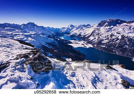 View of snow covered mountains, Engadin, Switzerland View Large Photo Image Stock Photo - View of snow covered mountains, Engadin, Switzerland. Fotosearch