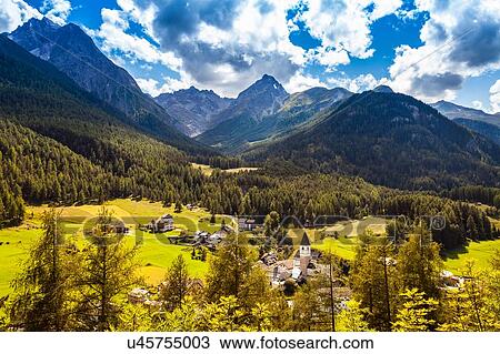 Stock Image - View of valley and mountains, Engadin, Switzerland. Fotosearch