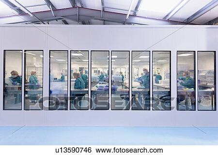 View of workers in clean room in surgical instrument factory View Large Photo Image Stock Photograph - View of workers in clean room in surgical instrument factory. Fotosearch
