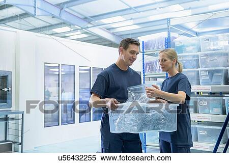 Warehouse workers in surgical instrument factory View Large Photo Image Stock Photography - Warehouse workers in surgical instrument factory. Fotosearch