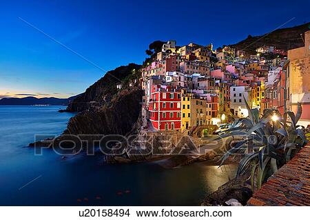 Picture - Waterfront town of Riomaggiore at night, Italy. Fotosearch