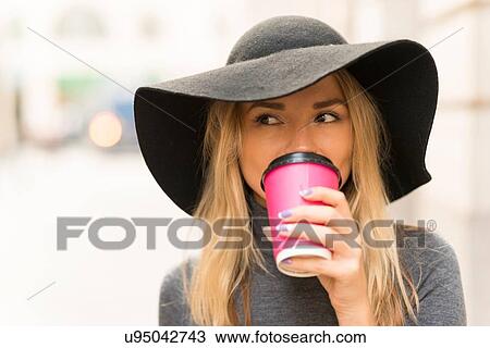 Woman having coffee in street View Large Photo Image Stock Image - Woman having coffee in street. Fotosearch