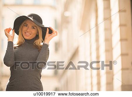 Stock Photo - Woman posing in street. Fotosearch
