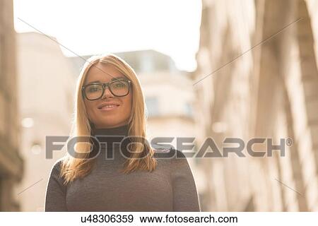 Woman posing in street View Large Photo Image Stock Photo - Woman posing in street. Fotosearch