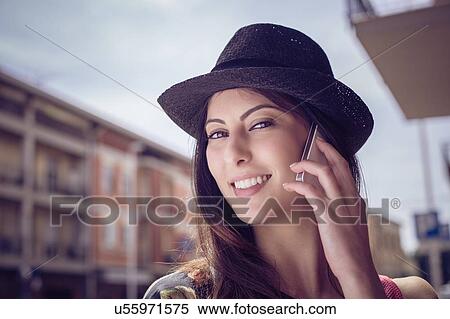 Stock Photography - Woman using smartphone, Cagliari, Sardinia, Italy. Fotosearch