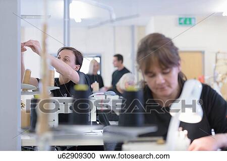 Workers sewing orthopaedic garments in factory View Large Photo Image Stock Image - Workers sewing orthopaedic garments in factory. Fotosearch
