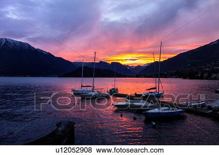 Yachts at sunset on Lake Como, Italy View Large Photo Image Stock Photo - Yachts at sunset on Lake Como, Italy. Fotosearch