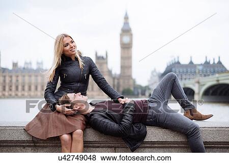 Stock Photo - Young couple on wall in front of Big Ben, London, England, UK. Fotosearch
