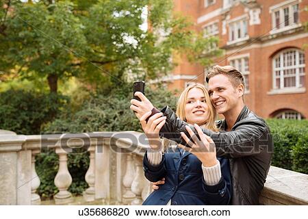 Young couple taking selfie outside Albert Hall, London, England, UK View Large Photo Image Stock Image - Young couple taking selfie outside Albert Hall, London, England, UK. Fotosearch