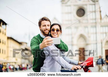 Young couple taking smartphone selfie in front of Basilica di Santa Croce, Florence, Italy View Large Photo Image Stock Image - Young couple taking smartphone selfie in front of Basilica di Santa Croce, Florence, Italy. Fotosearch