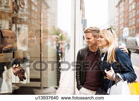 Young couple window shopping, London, England, UK View Large Photo Image Stock Image - Young couple window shopping, London, England, UK. Fotosearch