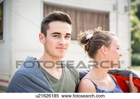 Young couple wrapped in blanket, outdoors View Large Photo Image Stock Photography - Young couple wrapped in blanket, outdoors. Fotosearch