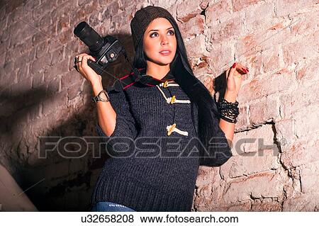 Young female photographer looking up from stairs in old industrial building View Large Photo Image Stock Photo - Young female photographer looking up from stairs in old industrial building. Fotosearch
