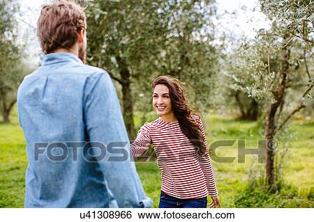 Young romantic couple in olive grove, Florence, Italy View Large Photo Image Stock Photograph - Young romantic couple in olive grove, Florence, Italy. Fotosearch