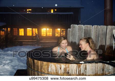 Young women enjoying hot tub View Large Photo Image Stock Photo - Young women enjoying hot tub. Fotosearch