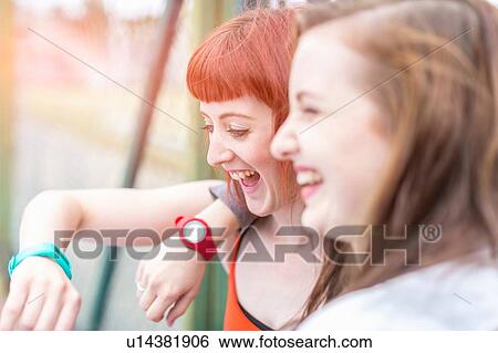 Young women laughing View Large Photo Image Stock Photograph - Young women laughing. Fotosearch