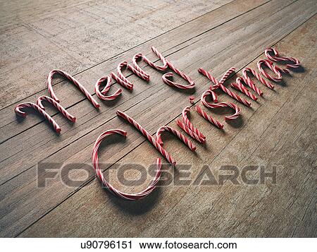 Clip Art - Merry christmas written with candy canes. Fotosearch