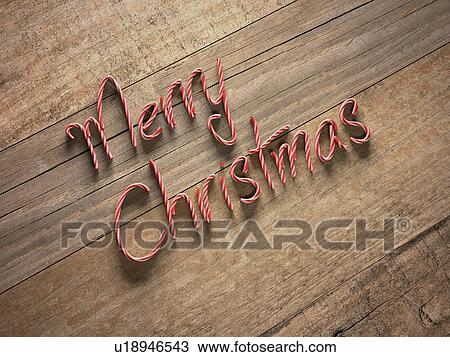 Merry christmas written with candy canes View Large Illustration Drawing - Merry christmas written with candy canes. Fotosearch