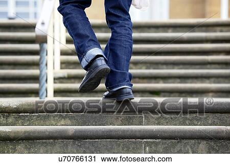 Clip Art - Person walking up steps. Fotosearch