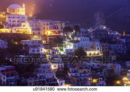 Stock Image - Aerial view of town at sunrise. Fotosearch