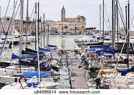 Boats in marina with city buildings in background View Large Photo Image Picture - Boats in marina with city buildings in background. Fotosearch