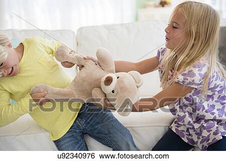 Boy (4-5) and girl (6-7) arguing View Large Photo Image Stock Photograph - Boy (4-5) and girl (6-7) arguing. Fotosearch