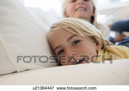 Boy (4-5) and girl (6-7) looking at camera View Large Photo Image Stock Photo - Boy (4-5) and girl (6-7) looking at camera. Fotosearch