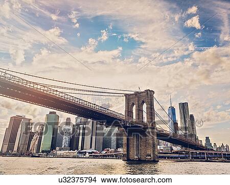 Picture - Brooklyn Bridge over Hudson River with Financial district in background. Fotosearch