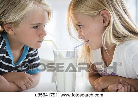 Brother (4-5) with sister (6-7) drinking milk from glass View Large Photo Image Stock Image - Brother (4-5) with sister (6-7) drinking milk from glass. Fotosearch