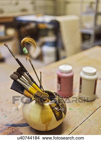 Brushes in bowl in art studio View Large Photo Image Picture - Brushes in bowl in art studio. Fotosearch