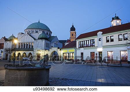 Buildings at town square at dusk View Large Photo Image Stock Image - Buildings at town square at dusk. Fotosearch