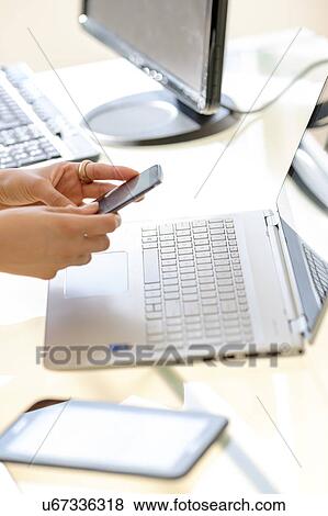 Stock Photo - Business woman texting. Fotosearch