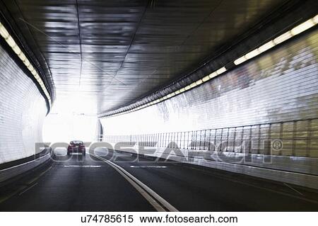 Car driving in tunnel View Large Photo Image Stock Photography - Car driving in tunnel. Fotosearch