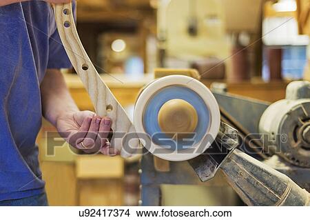 Carpenter polishing wood with sander View Large Photo Image Picture - Carpenter polishing wood with sander. Fotosearch