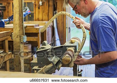 Carpenter polishing wood with sander View Large Photo Image Stock Image - Carpenter polishing wood with sander. Fotosearch