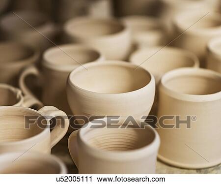 Stock Image - Clay products in workshop. Fotosearch