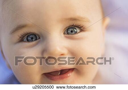 Close-of baby boy's (6-11 months) smiling face View Large Photo Image Stock Image - Close-of baby boy's (6-11 months) smiling face. Fotosearch