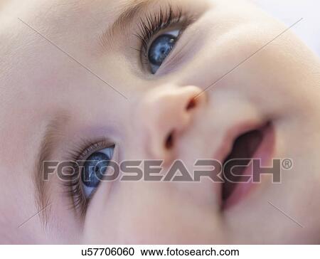 Stock Image - Close-of baby boy's (6-11 months) smiling face. Fotosearch