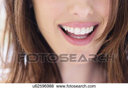 Stock Photo - Close up of smiling woman. Fotosearch