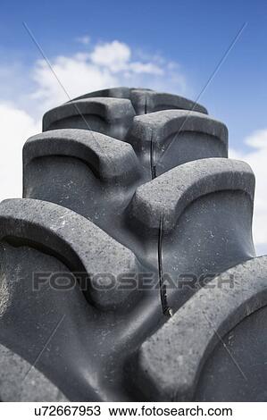 Stock Image - Close up of tractor tire. Fotosearch