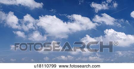Stock Photo - Clouds against blue sky. Fotosearch
