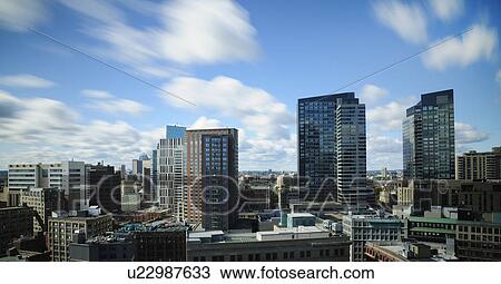 Clouds over modern city View Large Photo Image Stock Image - Clouds over modern city. Fotosearch
