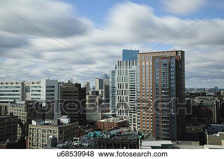 Clouds over modern city View Large Photo Image Stock Photo - Clouds over modern city. Fotosearch