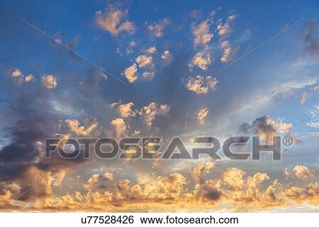Cloudscape at sunset View Large Photo Image Stock Photograph - Cloudscape at sunset. Fotosearch