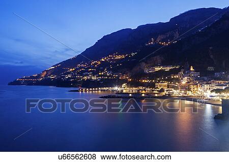 Stock Photo - Coastal town at night. Fotosearch